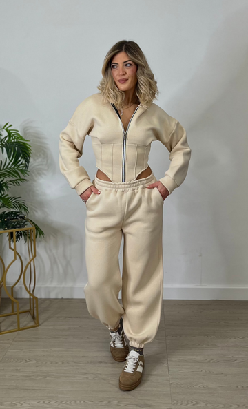 Tuta cropped con corsetto e joggers - beige